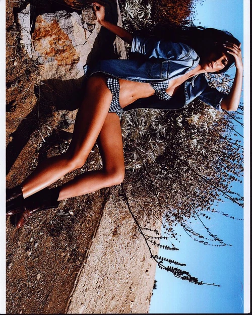 Genesis Rodriguez Sitting On Rocks In Black And White Plaid Bikini Photo Print