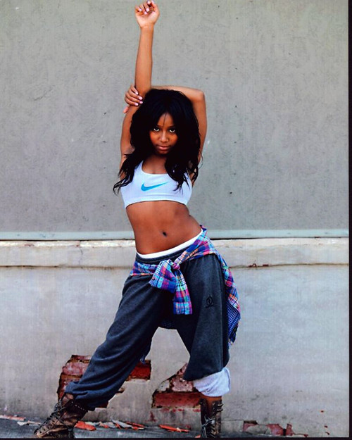 Jahnee Wallace With Arm Up In Sweatpants And Boots Photo Print - Item # MVM59543