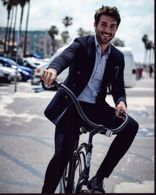 James Wolk In Suit Riding Bicycle Photo Print - Item # MVM57531
