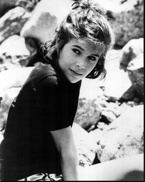Alyssa Milano Sitting On Rocks Looking Over Shoulder Black And White Photo Print - Item # MVM56023