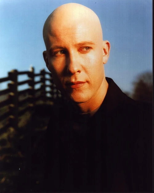 Michael Rosenbaum Close Up By Fence For Smallville Photo Print