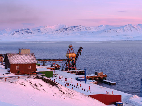 Harbor area Russian coal mining town Barentsburg at fjord Gronfjorden Norway Poster Print - Martin Zwick