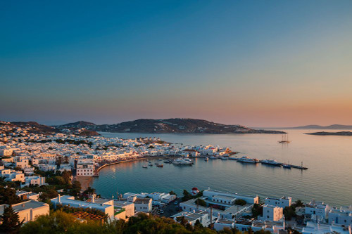 Scenic view of Chora and the nearby sea at sunset Chora-Mykonos Island-Cyclades Islands-Greece Poster Print - Sergio Pitamitz