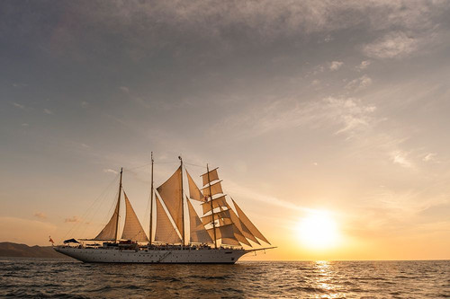 The Star Flyer sailing cruise ship underway at sunset Costa Rica Poster Print - Sergio Pitamitz