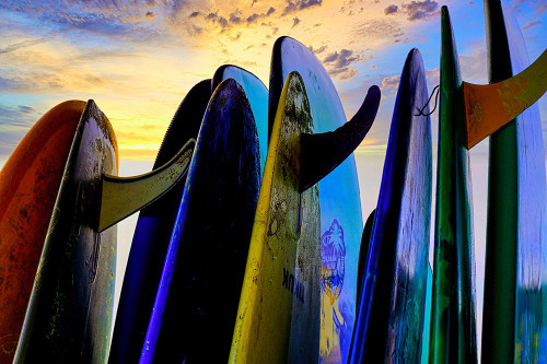 Stacked surf boards at sunset after a day of surf school in Canggu-Bali-Indonesia Poster Print - Greg Johnston