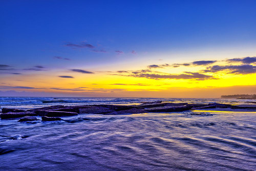 incredible colors of the sunset ritual on Pererenan Beach Bali-Indonesia Poster Print - Greg Johnston