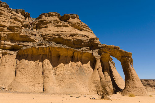 Tin Ghalega rock formation-Red Rhino Arch Wadi Teshuinat-Akakus-Fezzan-Libya Poster Print - Sergio Pitamitz