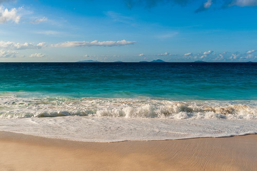Indian Ocean surf surging onto a sandy tropical beach Anse Macquereau Beach-Seychelles Poster Print - Sergio Pitamitz