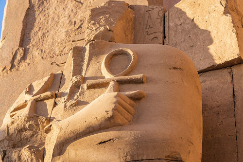 Karnak-Luxor-Egypt Ruined statue holding two ankhs at the Karnak Temple Complex Poster Print - Emily M. Wilson