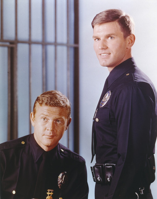 Adam-12 posed with Police Officer Uniform Near a Cell in a Movie Scene Photo Print - Item # VARCEL680769