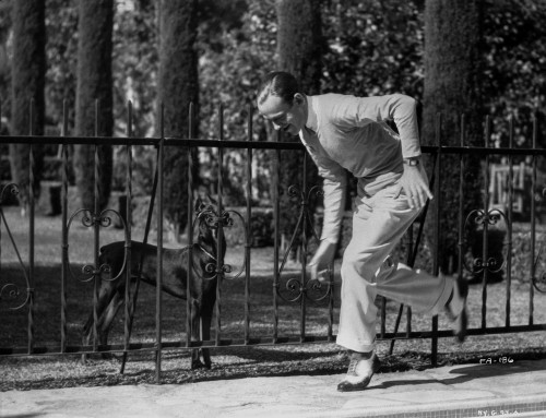 Fred Astaire Playing with Dog Photo Print - Item # VARCEL680950