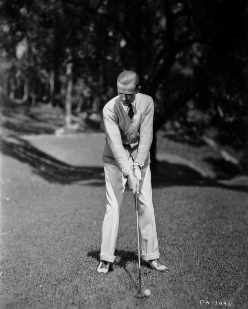 Fred Astaire Playing Golf on Grass Field Photo Print - Item # VARCEL680987