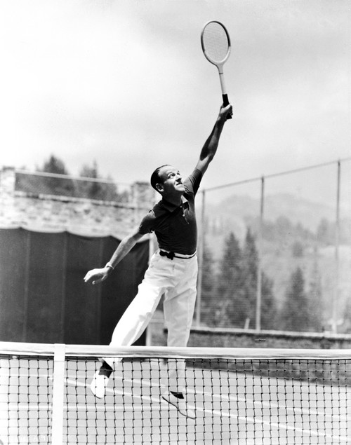 Fred Astaire Playing Tennis in White Pants Photo Print - Item # VARCEL681000