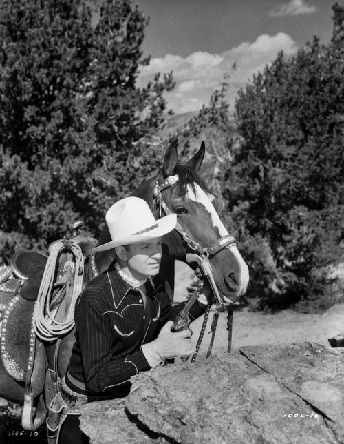 Gene Autry Hiding Behind a Big Rock Photo Print - Item # VARCEL681147