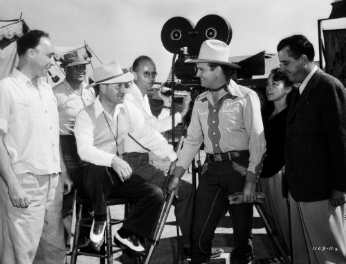 Gene Autry Talking to a Man Seated on Chair Photo Print - Item # VARCEL681164