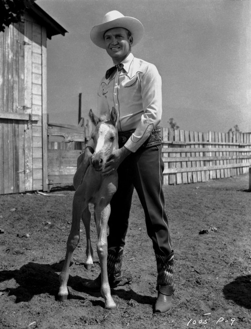Gene Autry Posed with a Pony Photo Print - Item # VARCEL681166