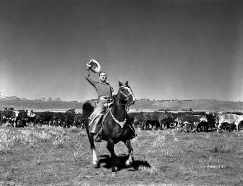 Gene Autry Riding a Horse and Holding a Western Hat Photo Print - Item # VARCEL681168