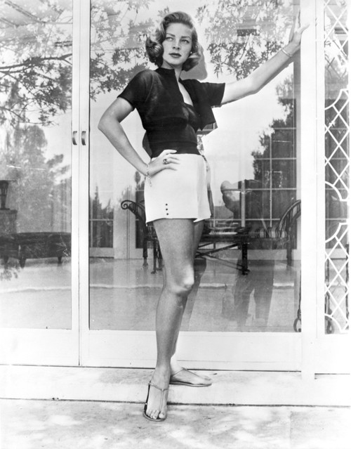 Lauren Bacall wearing shorts by a door Photo Print - Item # VARCEL681246