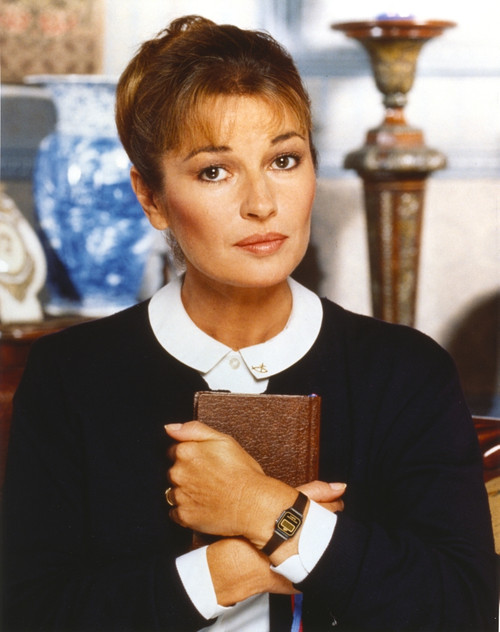 Stephanie Beacham Posed in a Portrait hugging Bible Photo Print - Item # VARCEL681812