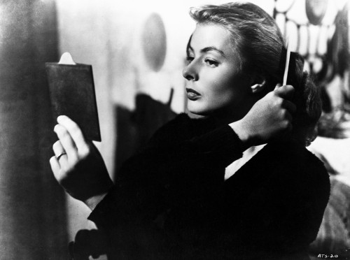 Ingrid Bergman Combing Her Hair and Holding a Mirror Photo Print - Item # VARCEL681962
