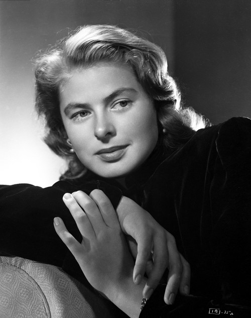 Ingrid Bergman sitting and Leaning on a Couch in a Black Long Sleeve Polo Photo Print - Item # VARCEL681989