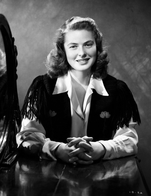 Ingrid Bergman sitting and smiling in a Long Sleeve Dress with a Collar Photo Print - Item # VARCEL682014