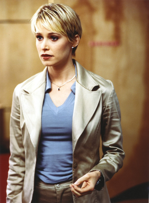 Josie Bissett Posed in Glossy Coat and Blue Shirt Portrait Photo Print - Item # VARCEL682148