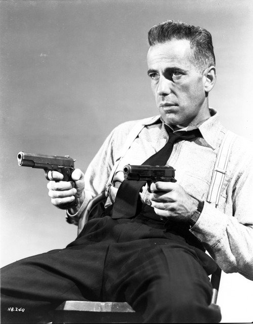 Humphrey Bogart aiming guns Photo Print - Item # VARCEL682243