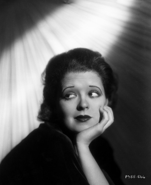 Clara Bow Head Leaning on Hand, wearing Black Dress Photo Print - Item # VARCEL682412