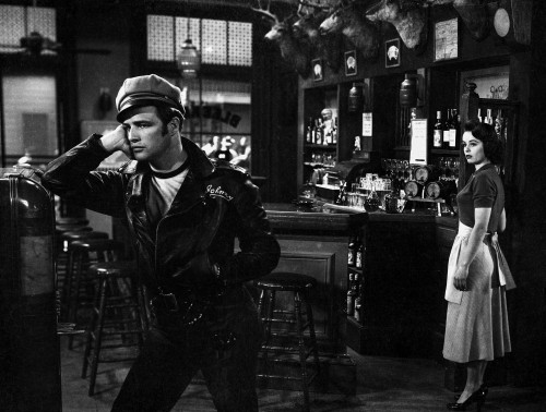 Marlon Brando Movie Scene with a Man in Black Leather Jacket Talking to a Woman Photo Print - Item # VARCEL682580