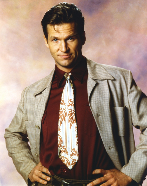 Jeff Bridges posed in Portrait in Grey Long Sleeve Coat and Red Collar Shirt with White Silver Necktie and Hands on the Hips Photo Print - Item # VARCEL682731