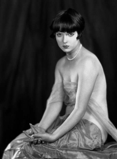 Louise Brooks sitting in Sexy Dress with Black Background Photo Print - Item # VARCEL682844