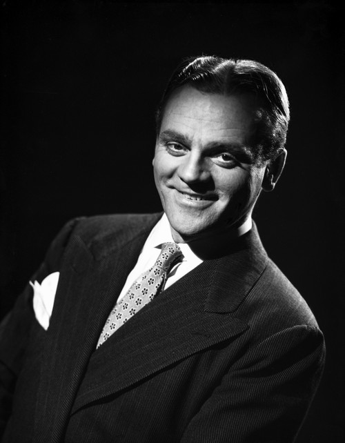 James Cagney smiling and Leaning to the Right in Black Velvet Tuxedo and Polka Dot Necktie Photo Print - Item # VARCEL683221