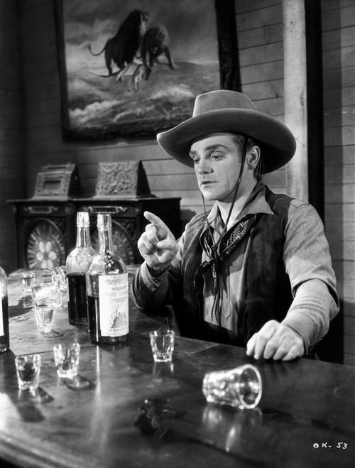 James Cagney sitting on the Chair In front of the Table in Vest Shirt and Long Sleeve Collar Shirt with Cowboy Brimmed Hat Photo Print - Item # VARCEL683243