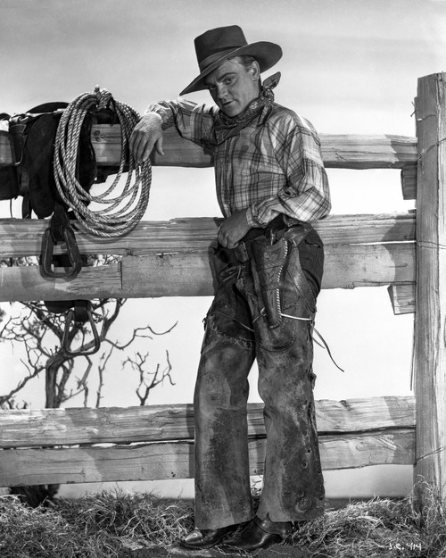 James Cagney Posed Facing to the Right in Checkered Long Sleeve Shirt and Cowboy Hat while Leaning on the Wood Fence with Left Hand on the Belt Photo Print - Item # VARCEL683265