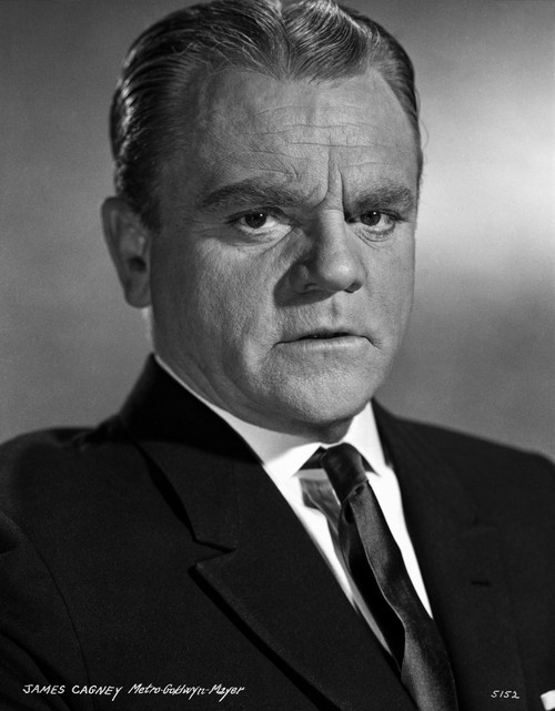 James Cagney Portrait Looking Serious in Black Velvet Suit and Black Silk Necktie with White Collar Shirt and Brushed Up Hair on Grey Background Photo Print - Item # VARCEL683270