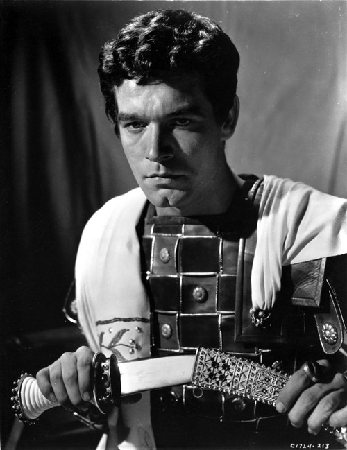 Stephen Boyd drawing a knife in a historical costume Photo Print - Item # VARCEL683677