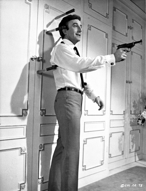 Film still of Peter Sellers holding a gun Photo Print - Item # VARCEL683722
