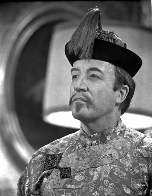 A film still of Peter Sellers wearing a Chinese costume Photo Print - Item # VARCEL683725