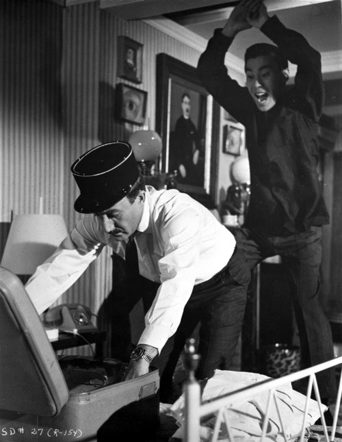 Film still of Peter Sellers as Inspector Clouseau with a man behind him Photo Print - Item # VARCEL683728