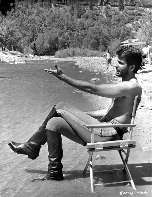 George Hamilton shirtless beside a lake Photo Print - Item # VARCEL683795
