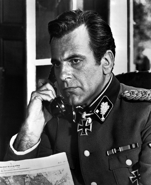Film still of Maximilian Schell wearing a military uniform and talking on the telephone Photo Print - Item # VARCEL683838