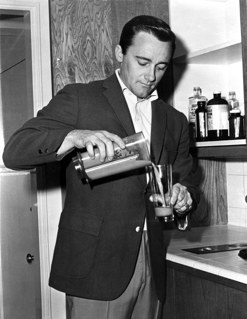 Robert Vaughn pouring a drink Photo Print - Item # VARCEL683869