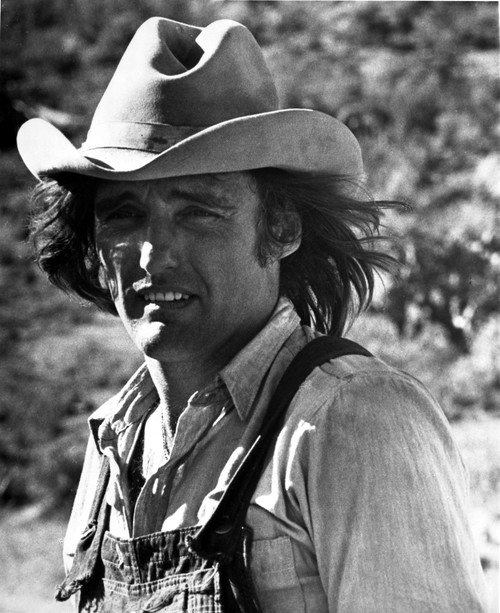 Dennis Hopper wearing a cowboy hat and overalls outdoors Photo Print - Item # VARCEL683901