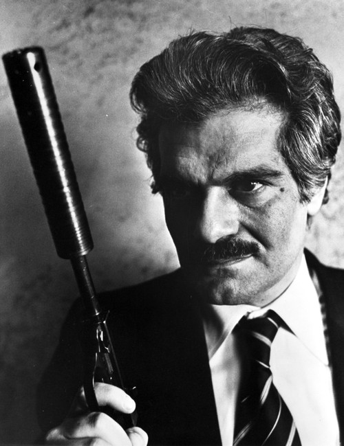 Omar Sharif holding a gun Photo Print - Item # VARCEL684051
