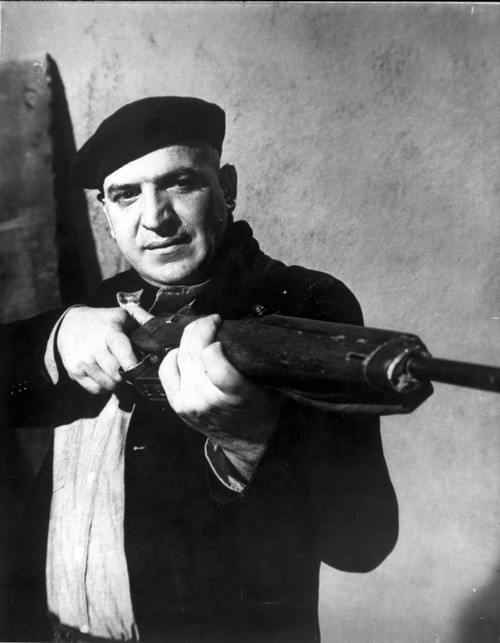 Telly Savalas pointing a gun Photo Print - Item # VARCEL684149