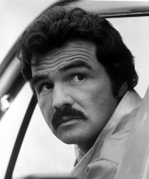 Film still of Burt Reynolds looking over his shoulder Photo Print - Item # VARCEL684171