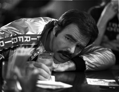 Burt Reynolds wearing a suit outdoors Photo Print - Item # VARCEL684185
