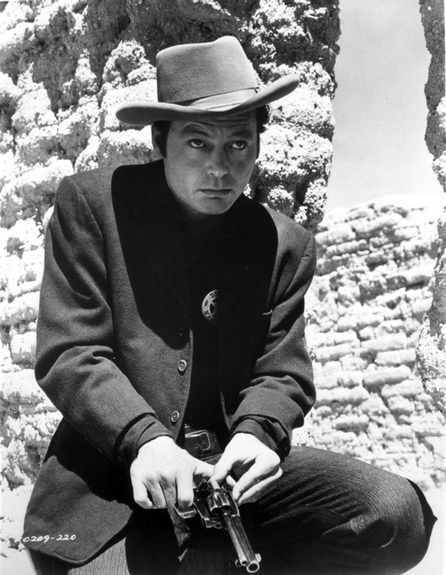 Deforest Kelly loading a gun Photo Print - Item # VARCEL684363