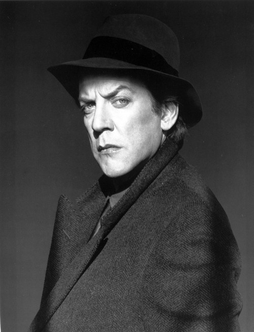 Donald Sutherland wearing a coat and a hat Photo Print - Item # VARCEL684381